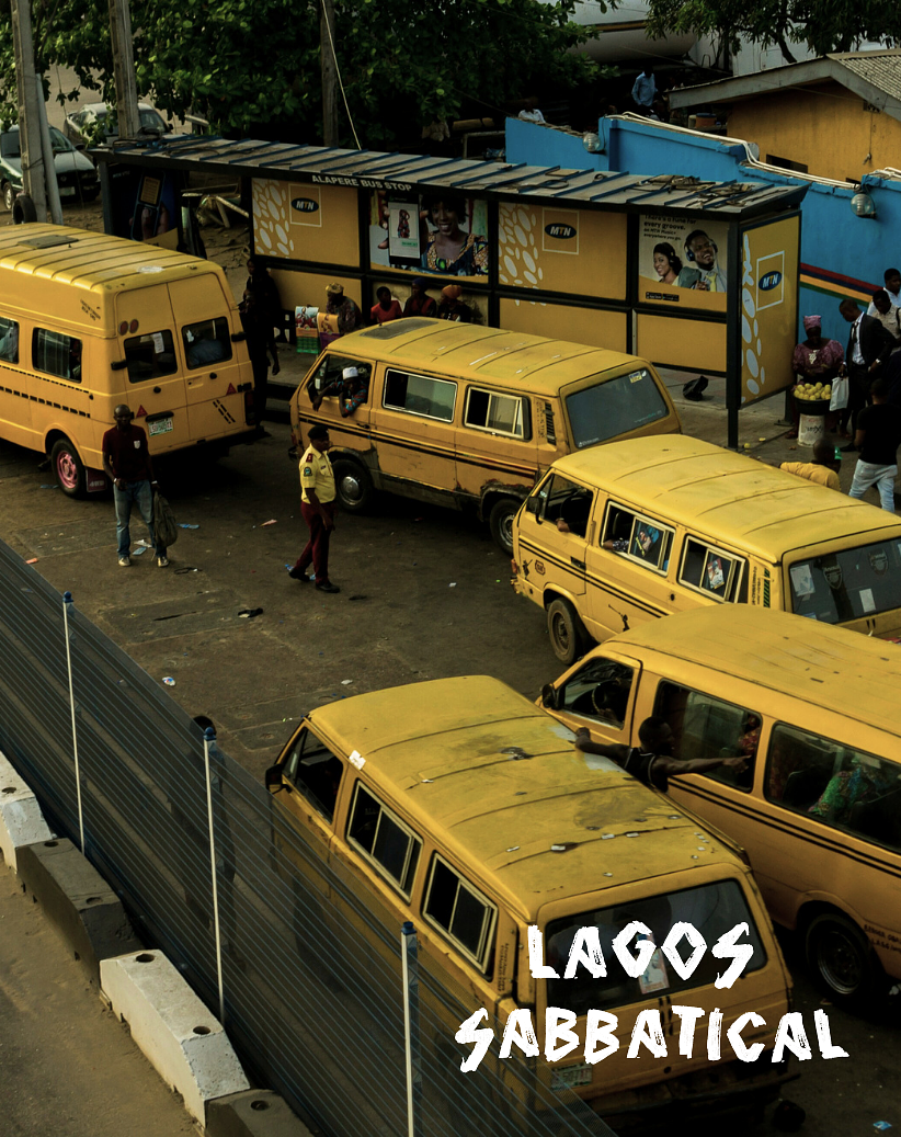 A busy bus stop in Lagos, Nigeria with multiple yellow buses parked and people waiting, some standing and others sitting, under a shelter with advertisements and trees in the background. The photo includes text that reads "Lagos Sabbatical."